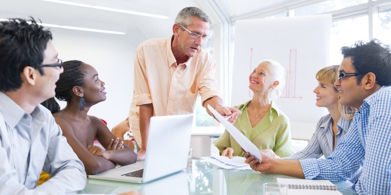 Group of Business People Learning With the Help of Their Mentor