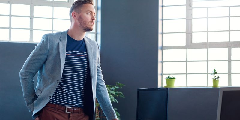 Entrepreneur standing in an office with a vision for success