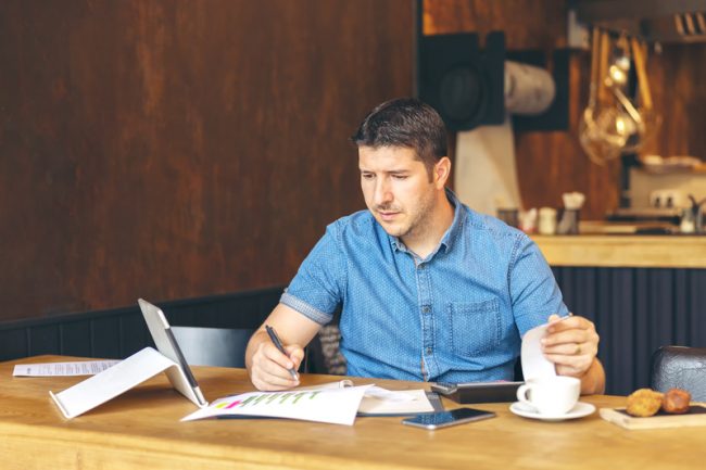 business owner calculating taxes