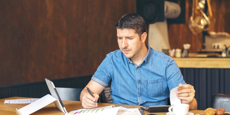 business owner calculating taxes