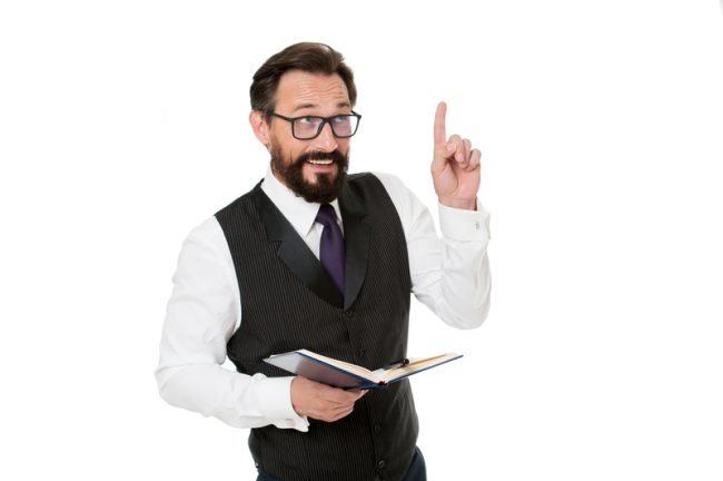 Man formal clothes hold notepad white explain business topic. Business school concept. Expert eyeglasses smart teacher. Business academy lecturer. Speaker business conference isolated white